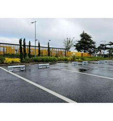 Utilisation de butées pour poids lourd sur un parking en extérieur
