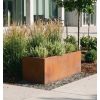 Jardinière en corten rectangulaire 60 cm devant bâtiment