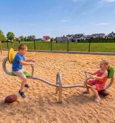 Balançoire à bascule en inox premium 2 places escargot dans un parc pour enfants